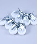 8 Pcs Inch Swivel PP Caster for Furniture, Silver Universal Wheel on a gray surface, featuring smooth white wheels and metal mounts.
