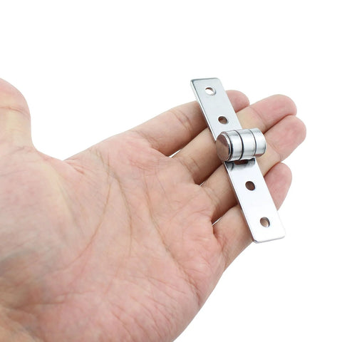 Hand-held close-up of silver stainless steel flush hinge, 86mm long for cabinets and doors.