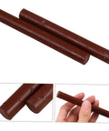 Dark Brown Wood Repair Kit Wax Filler Sticks For Floors Cabinets And Surfaces Easy To Use No Mess Scratch Repair Crayons That Hide Scuffs And Scratches Fast Fix For Furniture shown in hand and close-up