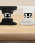 Heavy Duty Rv Door Stopper And Holder Set With Silicone Baggage Catch, black and white stoppers on a wooden surface.