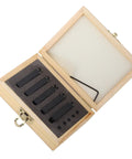 Six carbide turning tools in a wooden box with foam insert and a small hex wrench