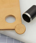 Close-up of leather with circular cut using 21 Piece Leather Circle Cutter Set Pro Grade Circle Punch Kit 1mm To 55mm.