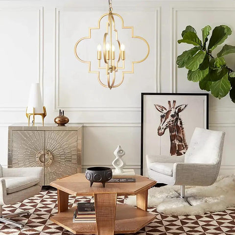 Room with Golden Orb Chandelier Four Light Pendant Ceiling Fixture In Candle Style Geometric Design above seating area.