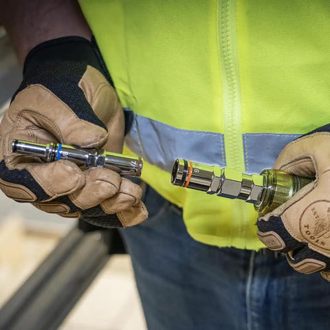 Person holding Do-It-All 9-In-1 Pass-Through Nut Driver with cushioned grip and SAE hex sizes tool, showing barrels.