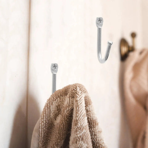 Thirty Pack Mini Iron Wall Hooks With Classic Silver Finish holding a towel on a bathroom wall for easy access.
