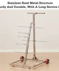 Stainless steel Turntable Cable Roller Stand With Wheels For Easy Wire Management And Spool Storage on a wood floor.
