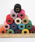 Colorful spools of Macrame Cord 1.5mm Cotton String Rope for DIY Crafts 109 Yards arrayed in a basket