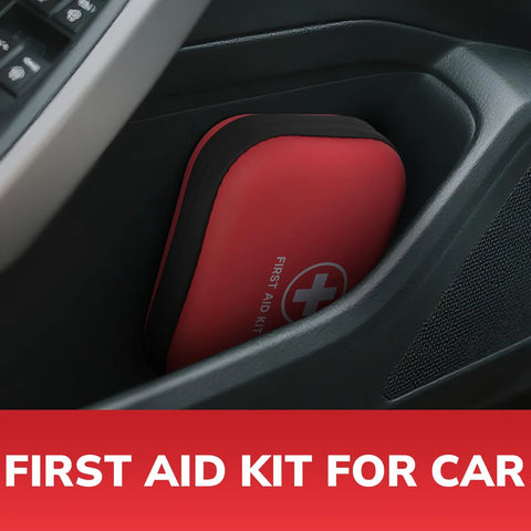 Red hard-shell first aid kit tucked in car console pocket