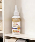 Waterproof Fabric Glue For Quick Dry, Clear Clothing Adhesive With Strong Hold, Flexible Textile Repair Solution, Precision Tip Bond For Denim Patches, Craft Fix That Mends Clothes Fast And Keeps It Looking Fresh bottle on shelf