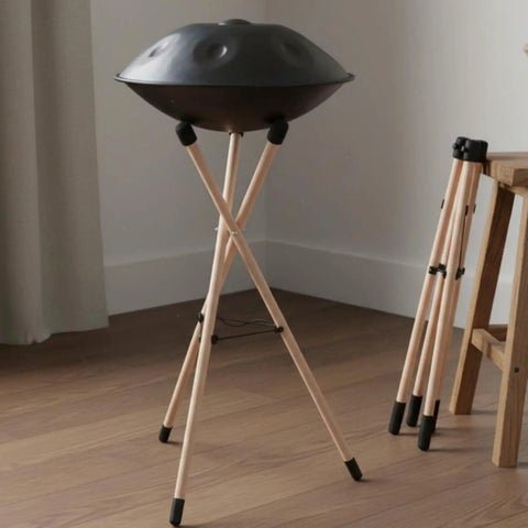Hella Sturdy Steel Drum Rack With Solid Beech Wood Tripod Stand, portable with foam pads, adjustable for home grooves or live shows.
