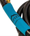 Close-up of 8501V 15 Foot Vacuum And Solution Hose Combo For Carpet Extractors, showing black coiled design with blue sleeve, easy maneuver.