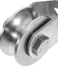 Close-up view of stainless steel industrial pulley wheel for cable guide roller heavy duty beefy roller ideal for door track and rolling gate systems.