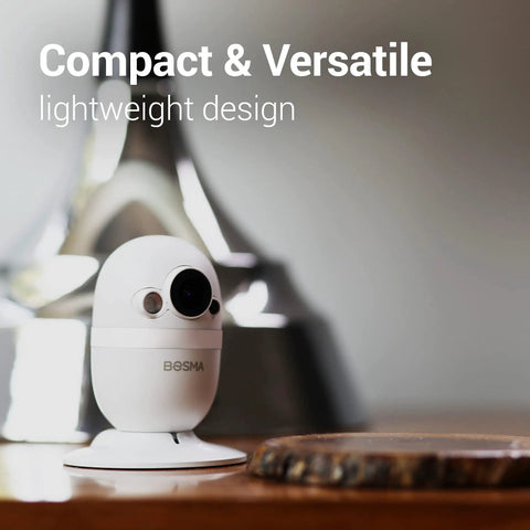 Compact CapsuleCam Pro Baby Monitor from 4 Pack 1080p HD WiFi Indoor Security Cameras with phone app 2 way audio on table
