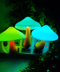 Two Pack LED Mushroom Night Lights Plug In Wall Lamps With 7 Color Changing Sensor glowing in green and blue