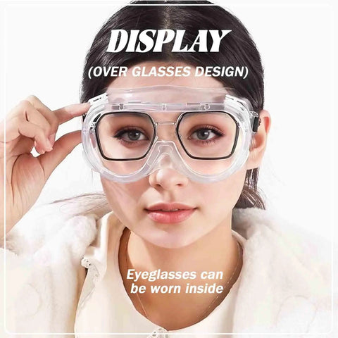 Woman wearing Anti-Fog Safety Goggles With Clear Lens For Industrial And Workshop Use, over regular eyeglasses, front view.