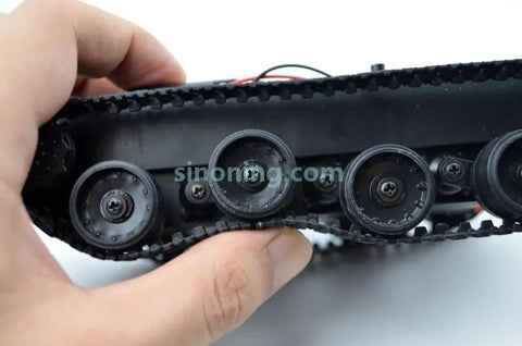Close-up of rubber track and suspension system on Mini Smart Robot Tank Chassis Kit With Rubber Track Crawler For Arduino And 130 Motor.