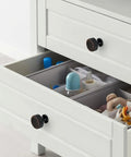 Slick Knurled Grip Cabinet Knobs And Drawer Pulls Finished In Matte Black With A Heavy Duty Zinc Core Designed To Level Up Any Kitchen Or Bath Quick Screw Mount Setup Drops In Ten Solid Bundles on a white drawer with organized items.