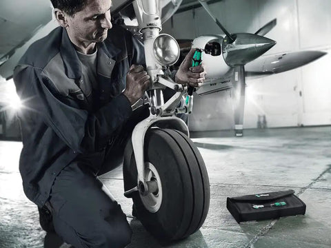 Engineer using Three Eighths Inch Zyklop Speed Ratchet With Inline Screwdriver Mode on airplane landing gear, 72-Tooth reversible ratchet