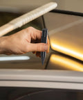 Hand holding scratch pen for car dent repair on car panel, Tough As Nails Auto Body Hammer And Car Dent Repair Pen For Quick Panel Fixes Effortlessly Smoothing Sheet Metal Dings On Your Daily Driver Rig With Durable Steel Build Black.
