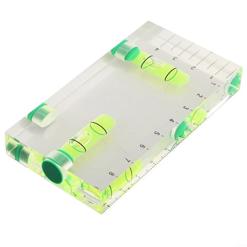 Transparent Bubble Level showing dual vials and built-in ruler, measuring 95 x 51 x 13 mm, ideal for leveling tasks.