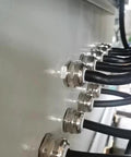 Close-up of installed Metal Waterproof M22 Cable Glands Set with Adjustable Joints for 10-13 mm Cables Durable Silver Connectors