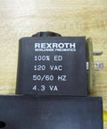 Rexroth Bosch Group 0-1313 Solenoid Valve, 120 VAC, 4.3 VA coil close-up on brown surface, visible electrical specifications.