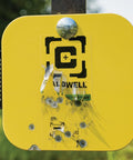 Close-up of yellow AR500 Long Range Gong Kit target with bullet holes, Flash Bang Hit Indicator. 18x24 inch, 3/8 inch thick.