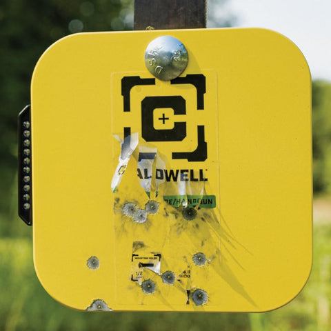 Close-up of yellow AR500 Long Range Gong Kit target with bullet holes, Flash Bang Hit Indicator. 18x24 inch, 3/8 inch thick.