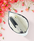 Funny Travel Makeup Bag For Women, Multiuse Cosmetic Case And Toiletry Organizer open with makeup brushes, surrounded by flowers