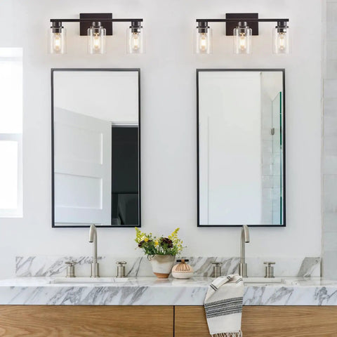 Sleek Matte Black 3 Light Vanity Light With Clear Glass Shades For Bathroom above double mirrors and sink