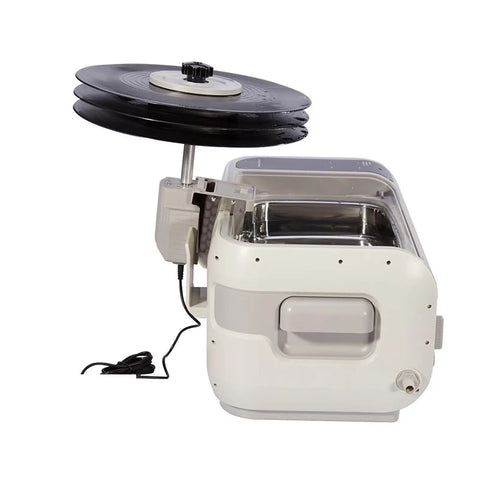 Top Shelf Ultrasonic Vinyl Cleaner Featuring Digital Controls And Stainless Steel Basin, holding three records for cleaning.