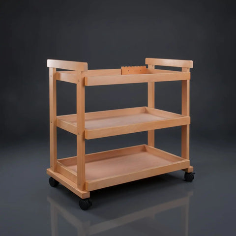 Sturdy Beech Wood Rolling Art Supply Cart With Wide Three Tier Shelves Secure Side Guards And Silky Smooth Wheels, angled view.