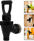 Heavy Duty Black Plastic Cooler Faucet And Reusable Spigot Tap With Leak Proof Seal For Water Buckets Party Coolers Beverage Dispenser, close-up view.