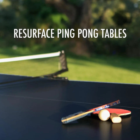 Outdoor ping pong table with net and paddles in sunny garden setting, showcasing surface ideal for recreational play.