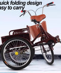 Wine red folding three wheel tricycle with cargo cabin, dual brakes, adjustable saddle, and heavy duty steel frame.