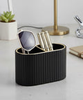 PU Leather Desk Organizer Pen Holder With Dual Compartment Pencil Cup And Remote Control Storage Black on a desk with accessories