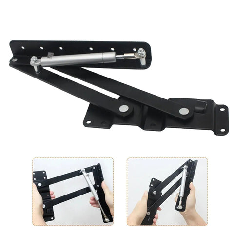 Two Piece Black Folding Spring Table Hinge For Lift Up Tables And Laptop Coffee Tables Heavy Duty Metal Hinge Hardware Roof Lift Mechanism Lift Frame Support 2.4mm And 4mm Thickness shown installed in hands.