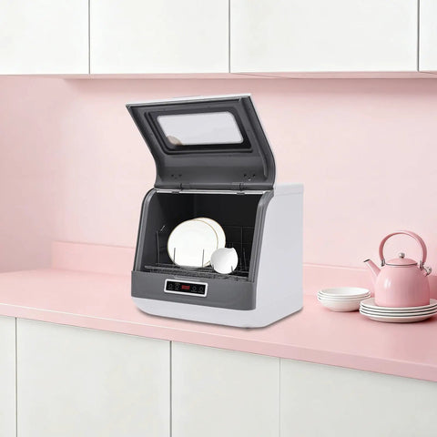 Hassle-Free Countertop Dishwasher With A Slick Stainless Steel Interior, Portable Kitchen Workhorse by a pink countertop.