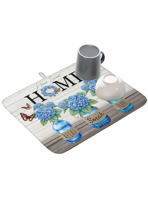Hydrangea Pattern Dish Drying Mat for Kitchen Counter 16x18 Inches with blue flowers, mugs on top, farmhouse wood grain design.