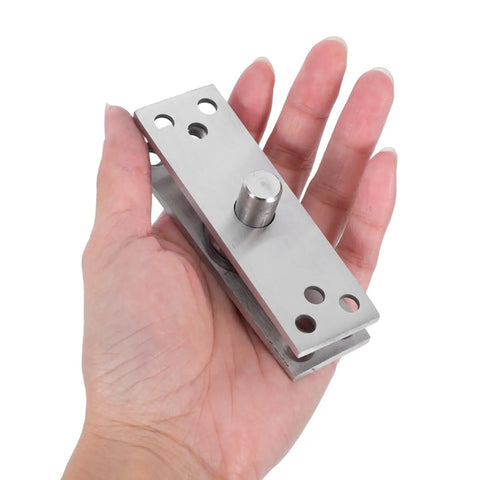 Stainless Steel Concealed Pivot Hinge Delivering Smooth As Butter 360 Rotation For Cabinets held in hand, highlighting the solid build and design.