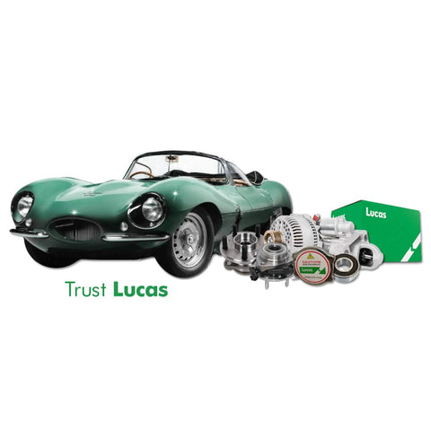 Classic green car with Lucas auto parts including alternator and packaging visible in the foreground