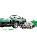 Vintage green convertible with Lucas auto parts including alternator, turbocharger, and green Lucas box alongside.