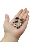 Person holding Awesome Micro Mini Slide Switch Kit 110Pcs SPDT 1P2T Toggle Switches with various models like SS12D00