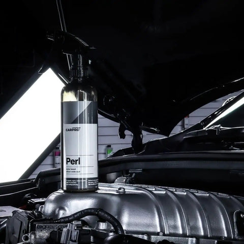 Perl Coat Plastic And Rubber Protectant For Cars on engine, 500 mL bottle revives dull surfaces with UV shield, lasts three months.