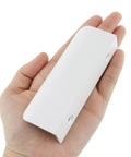 Person holding a White 3.94 Inch Curved Edge Finger Pulls 10 Pack For Cabinets And Dressers 64mm Hole Centers Aluminum Alloy Back Mount Concealed Handles