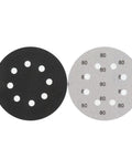 Kickstart Your Woodworking Projects With These Badass 5 Inch Silicon Carbide Sanding Discs showing two 5 inch discs with holes for dust extraction.