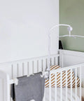 Top Notch 34 Inch Baby Crib Mobile Bed Bell Stand With Manual Wind Up Music Box displayed over a crib with plush toys.