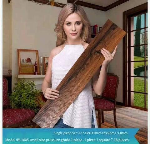 Woman holding Peel And Stick Vinyl Floor Planks Self Adhesive Wood Look Tiles 10 Pack 6 Inch Wide By 36 Inch Long Hickory