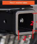 Close-up of a 2-inch receiver tube fitting on a vehicle, part of the All American Patriotic Trailer Hook Cover And Lock Set For 2-Inch Receiver, Heavy Duty Aluminum Housing With American Flag Emblem, Includes Hook Lock And Two Keys, Durable, Easy Install, Protection And Style.