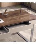 Next Level Standing Desk With Legit Storage Drawers And Rock Solid Steel Frame showing walnut top and open twin drawers.